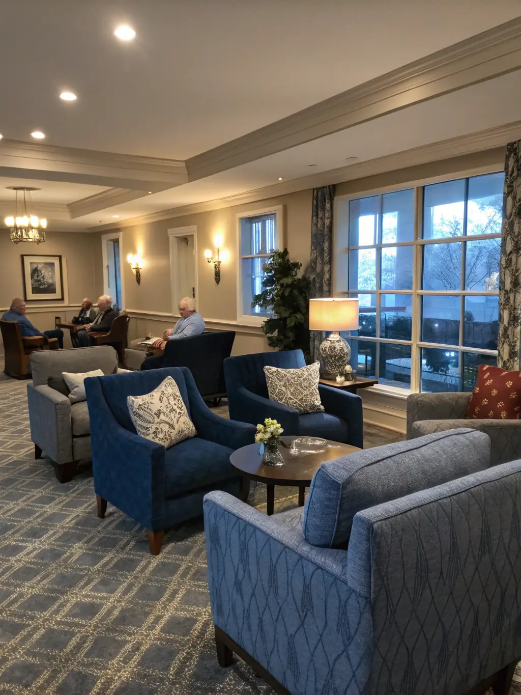 An elegant and spacious resident lounge with comfortable seating, a fireplace, and a coffee bar, emphasizing the community and social spaces at Enwan Residance.